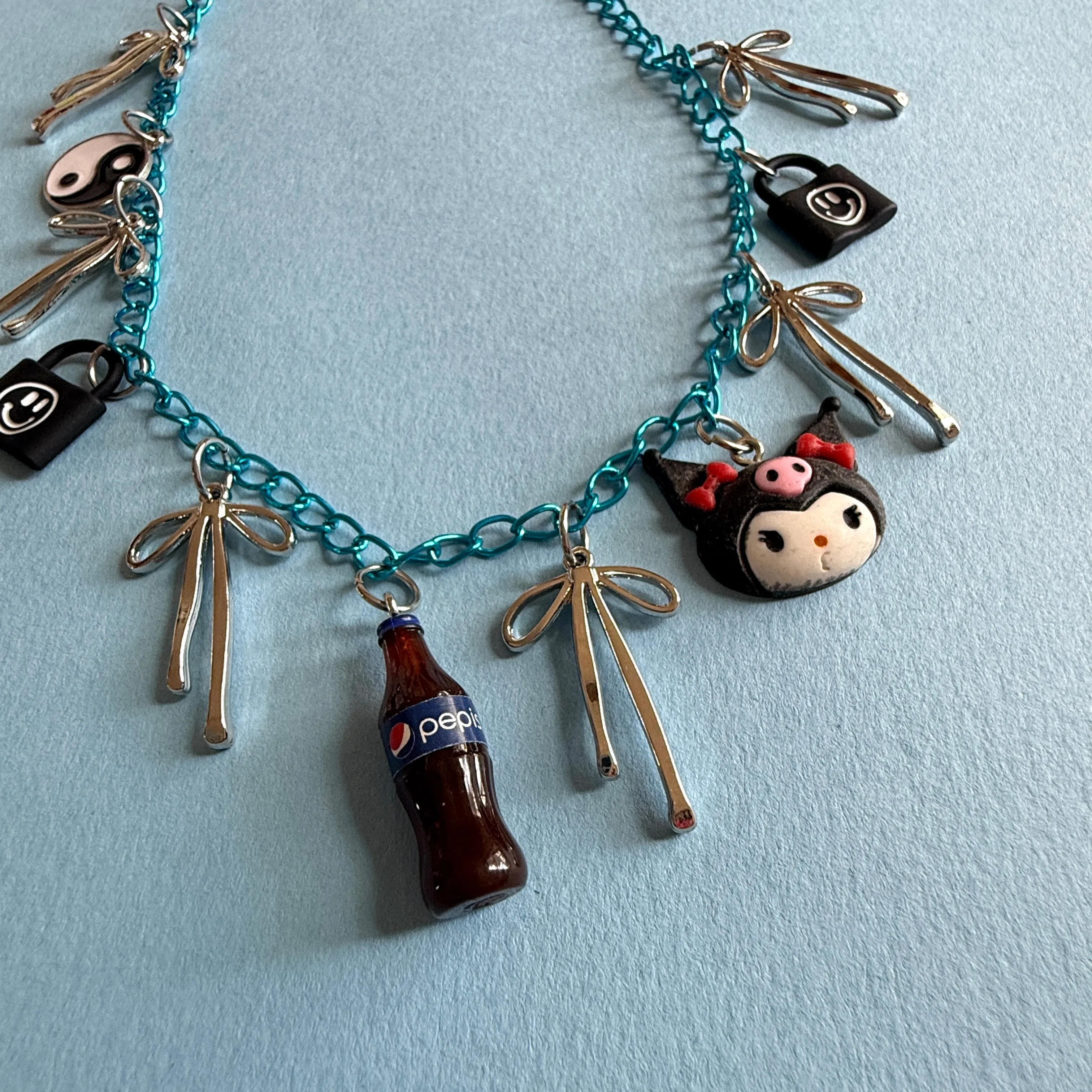 Emo bue charm necklace